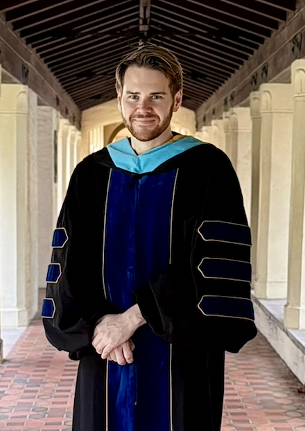 Dr. Levi Connolly in doctoral regalia